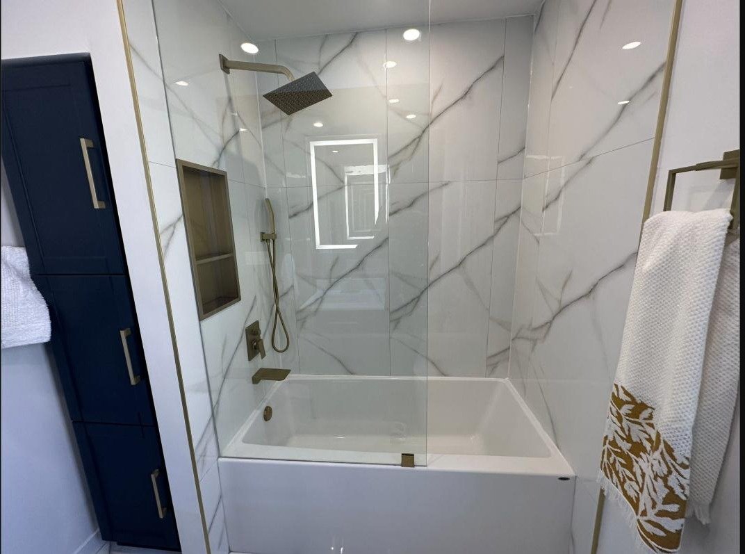Marble shower and tub surround completed by 404 Renovation Team